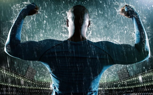NFL Player Showing off Guns in the Rain at the Stadium