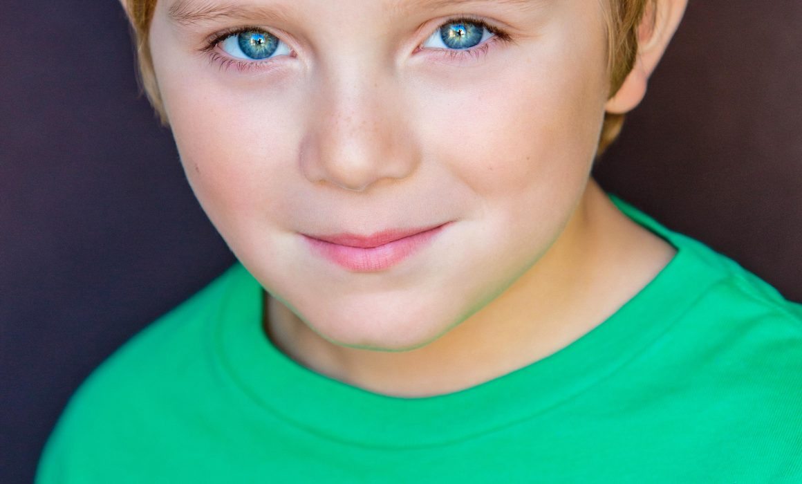 Boy in Green a Kids Headshot by Michael Roud Photography